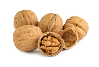 Photo of Pile of ripe walnuts on white background