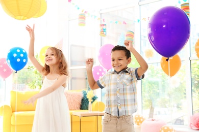 Cute little children at birthday party indoors