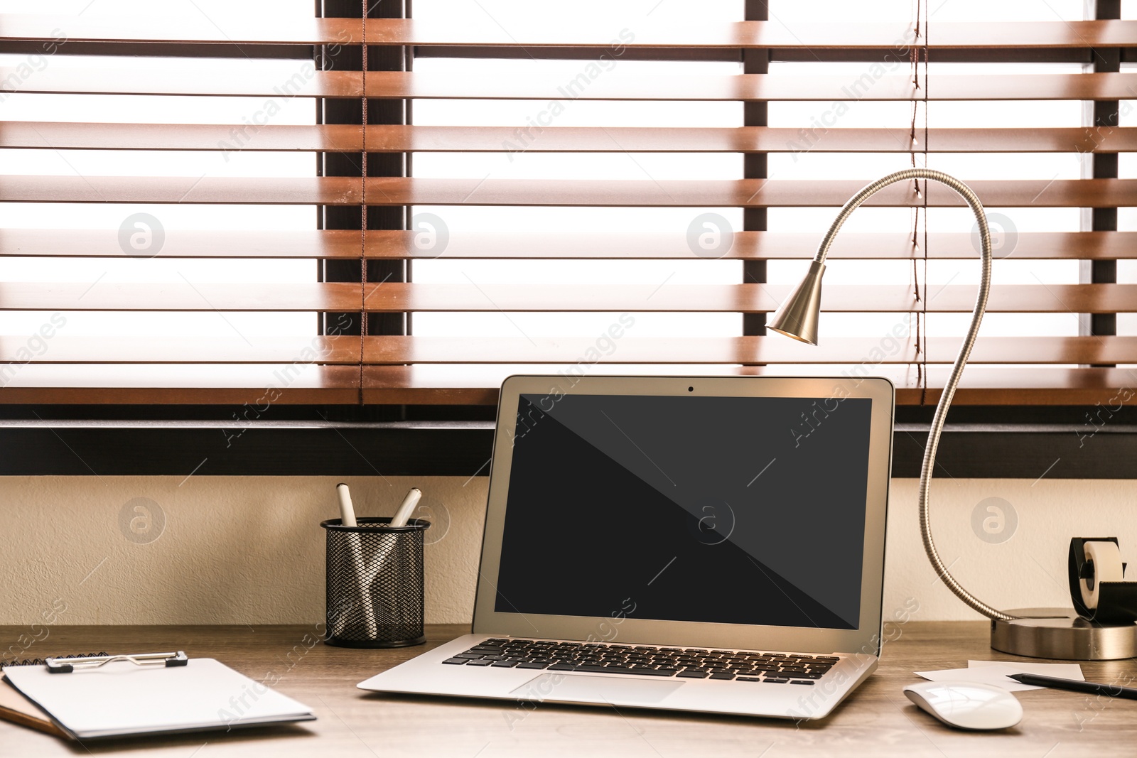 Image of Modern laptop on wooden table indoors. Comfortable workplace 