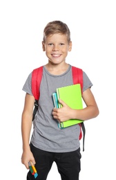 Little boy with backpack and notebooks on white background. Stationery for school