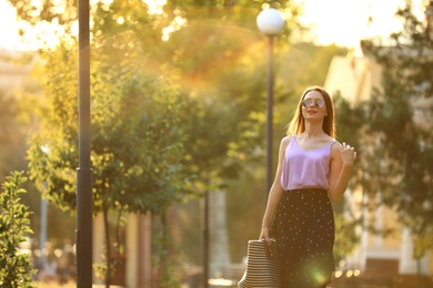 Photo of Beautiful young woman in park on sunny day