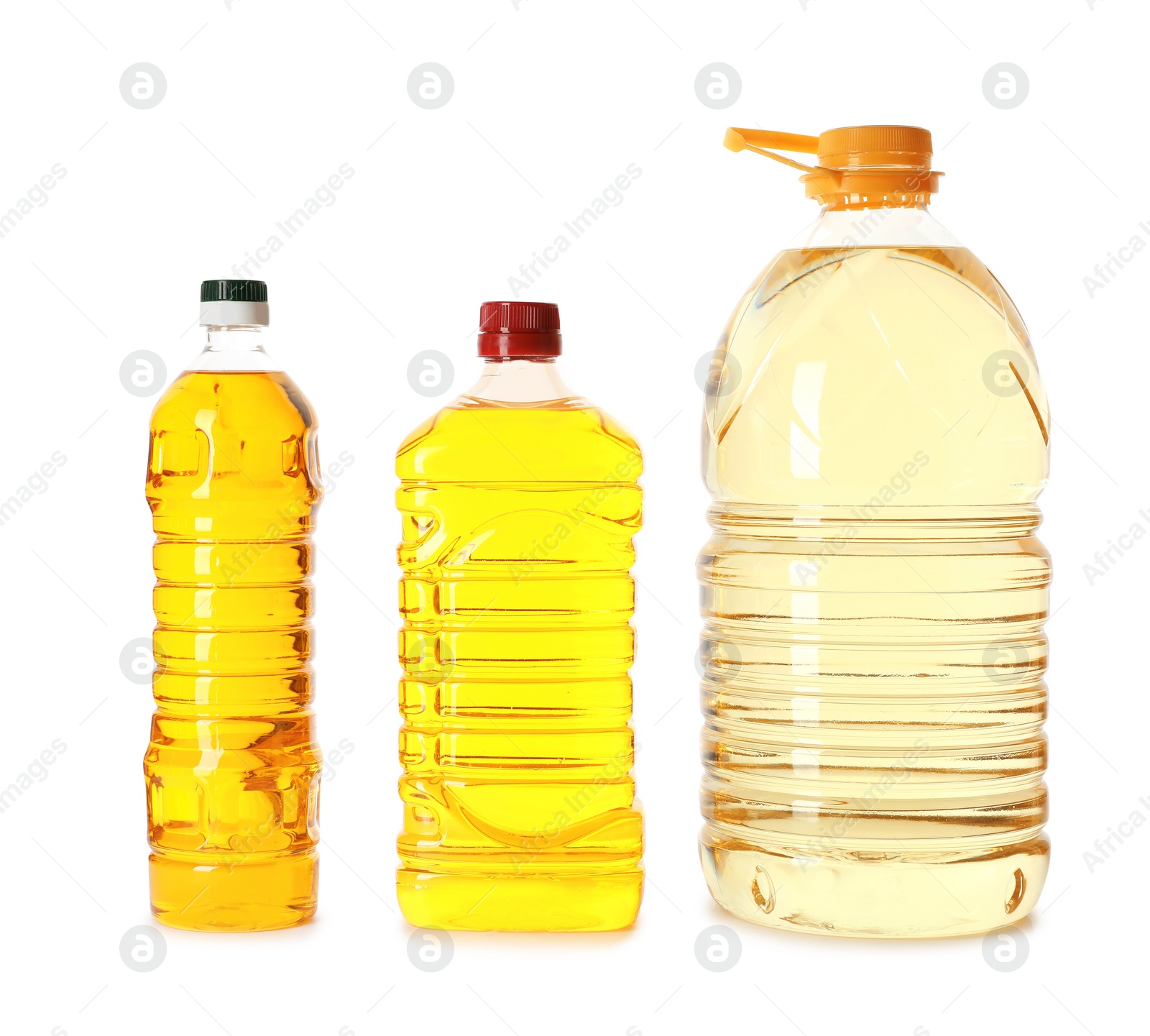 Photo of Different plastic bottles with oils on white background