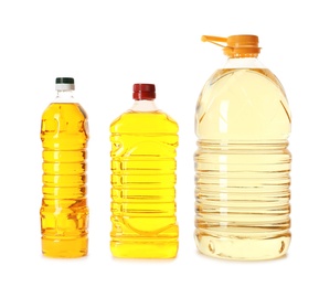 Photo of Different plastic bottles with oils on white background