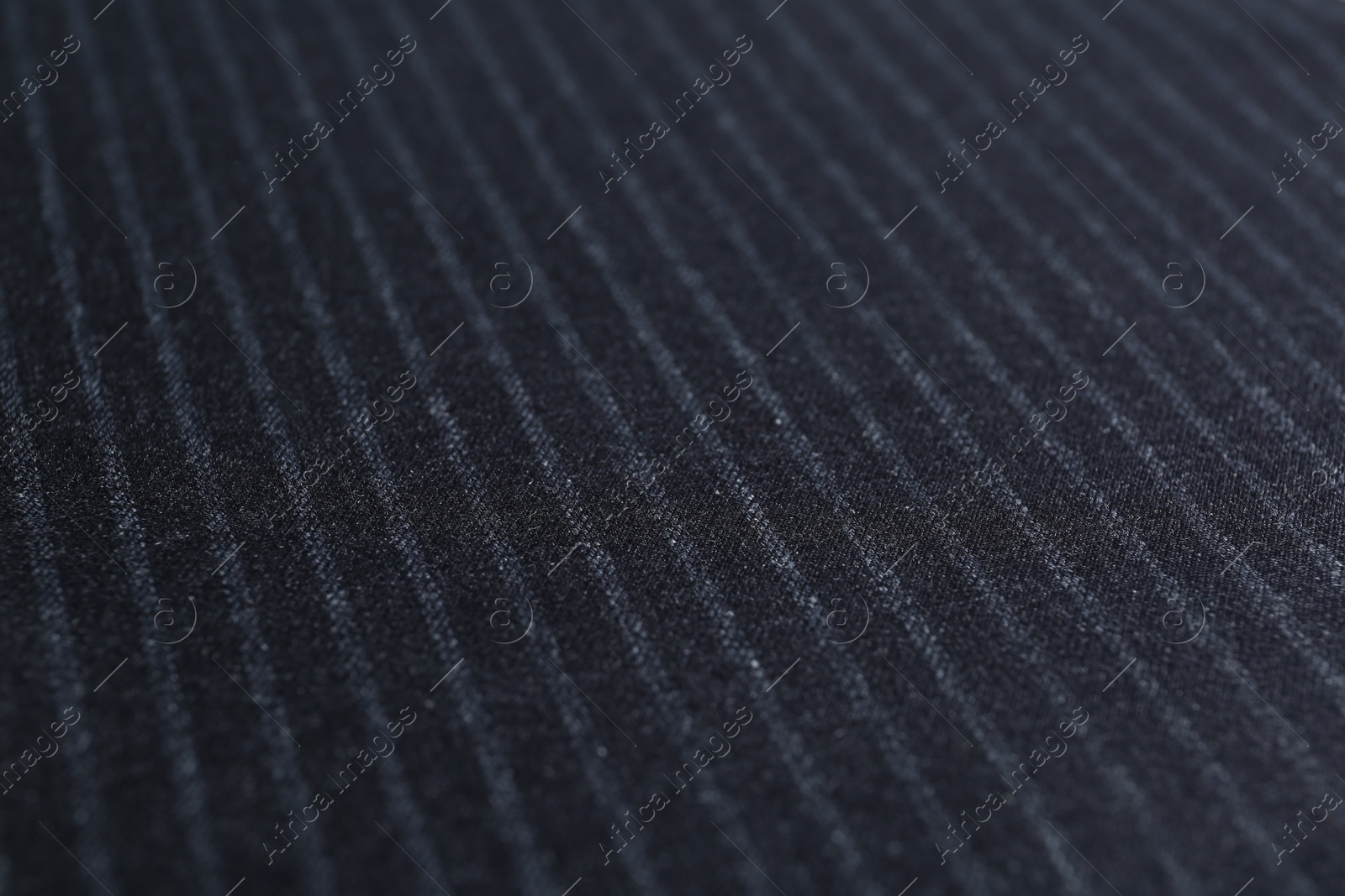 Photo of Texture of dark striped fabric as background, closeup