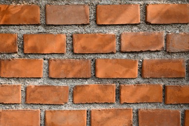 Texture of red brick wall as background, closeup view