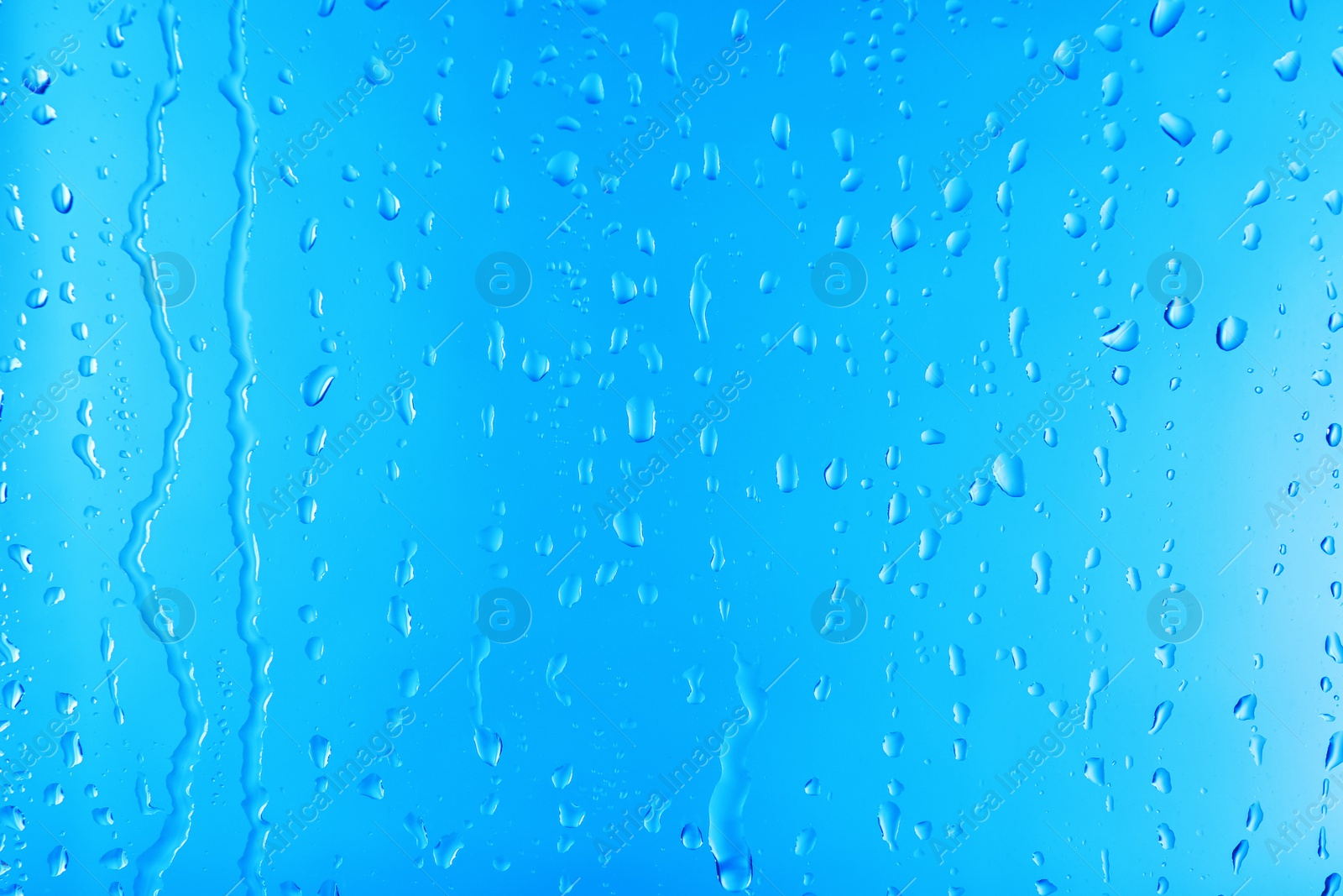 Photo of View of glass with water drops, closeup