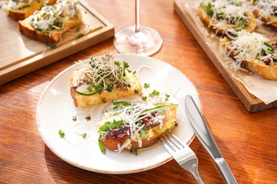 Delicious bruschettas served on wooden table in cafe