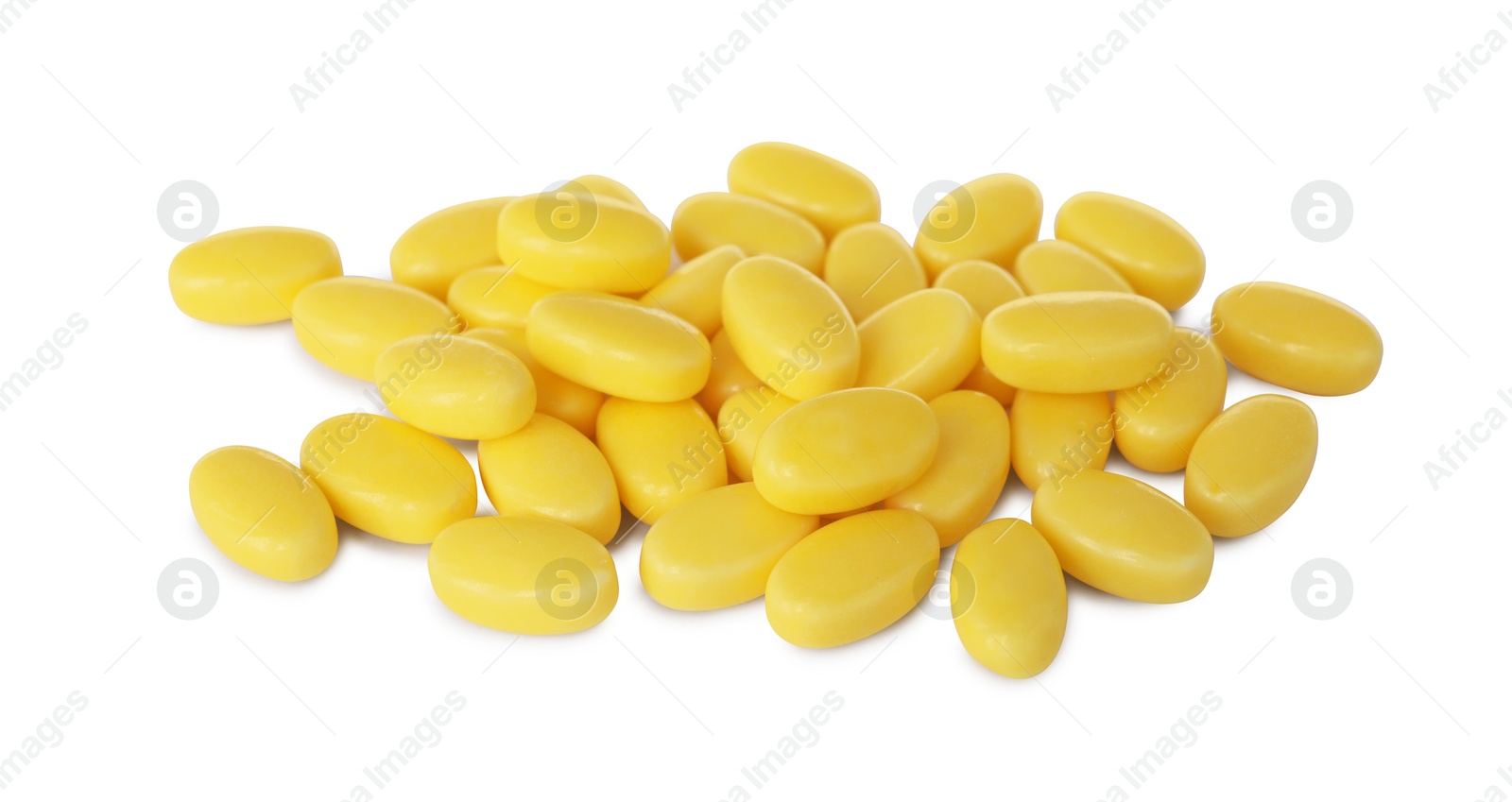 Photo of Tasty yellow dragee candies on white background