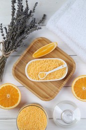 Photo of Sea salt, lavender, orange and towels on white wooden table, flat lay