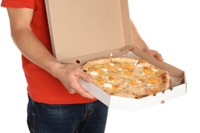 Young man with opened pizza box on white background. Food delivery service