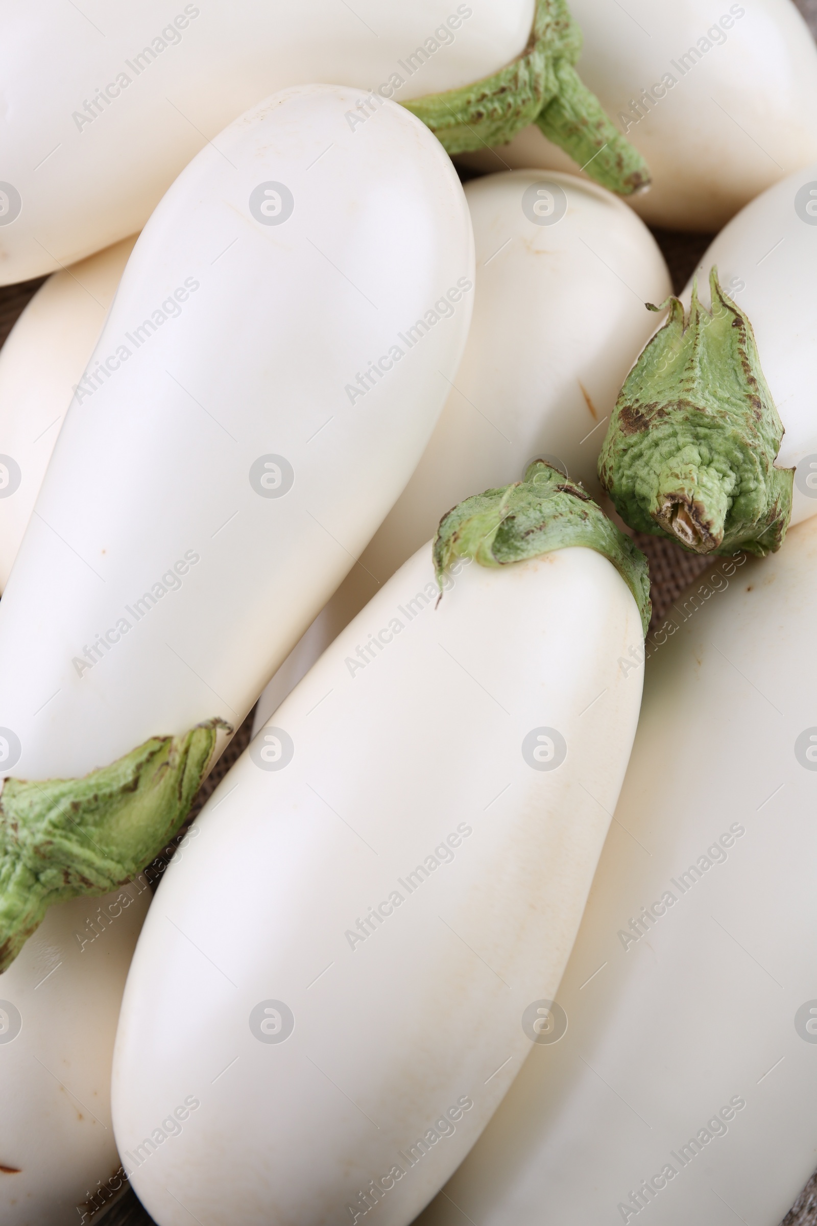 Photo of Fresh white eggplants as background, top view