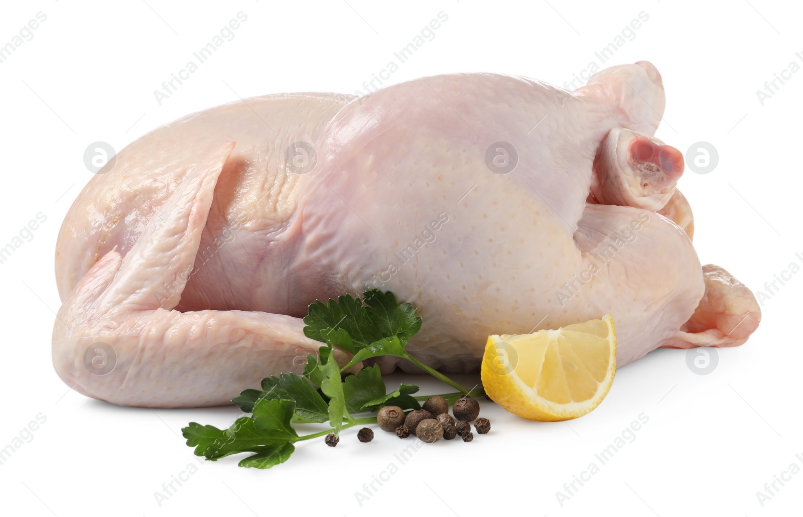 Photo of Fresh raw chicken with lemon and spices isolated on white