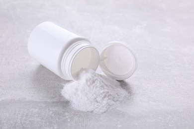 Photo of Bottle of sweet powder on light grey table