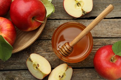 Photo of Sweet honey and fresh apples on wooden table, flat lay