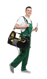 Young plumber with tool bag on white background