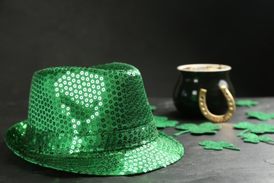 Leprechaun's hat and St. Patrick's day decor on black table