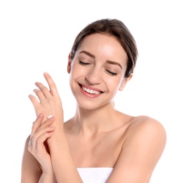 Photo of Young woman applying cream on her hand against white background. Beauty and body care