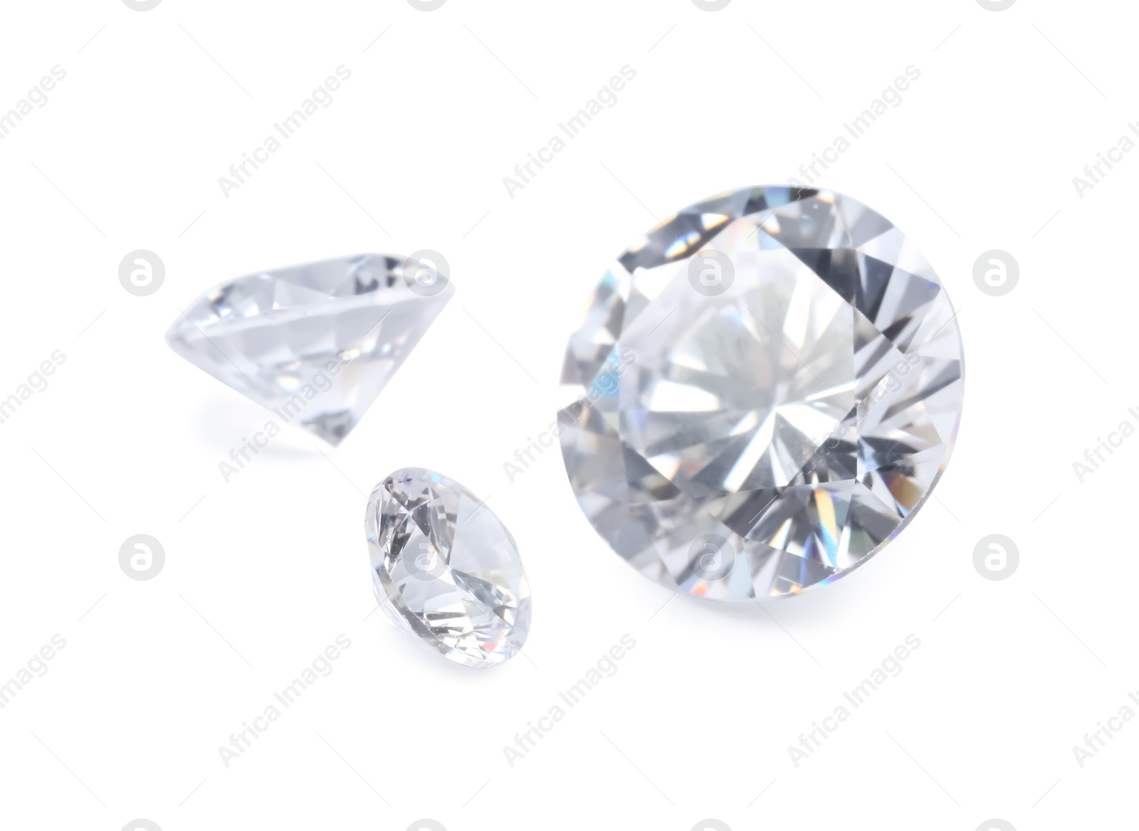 Photo of Different beautiful shiny diamonds isolated on white