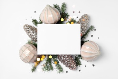 Beautiful Christmas decor and blank card on white background, flat lay
