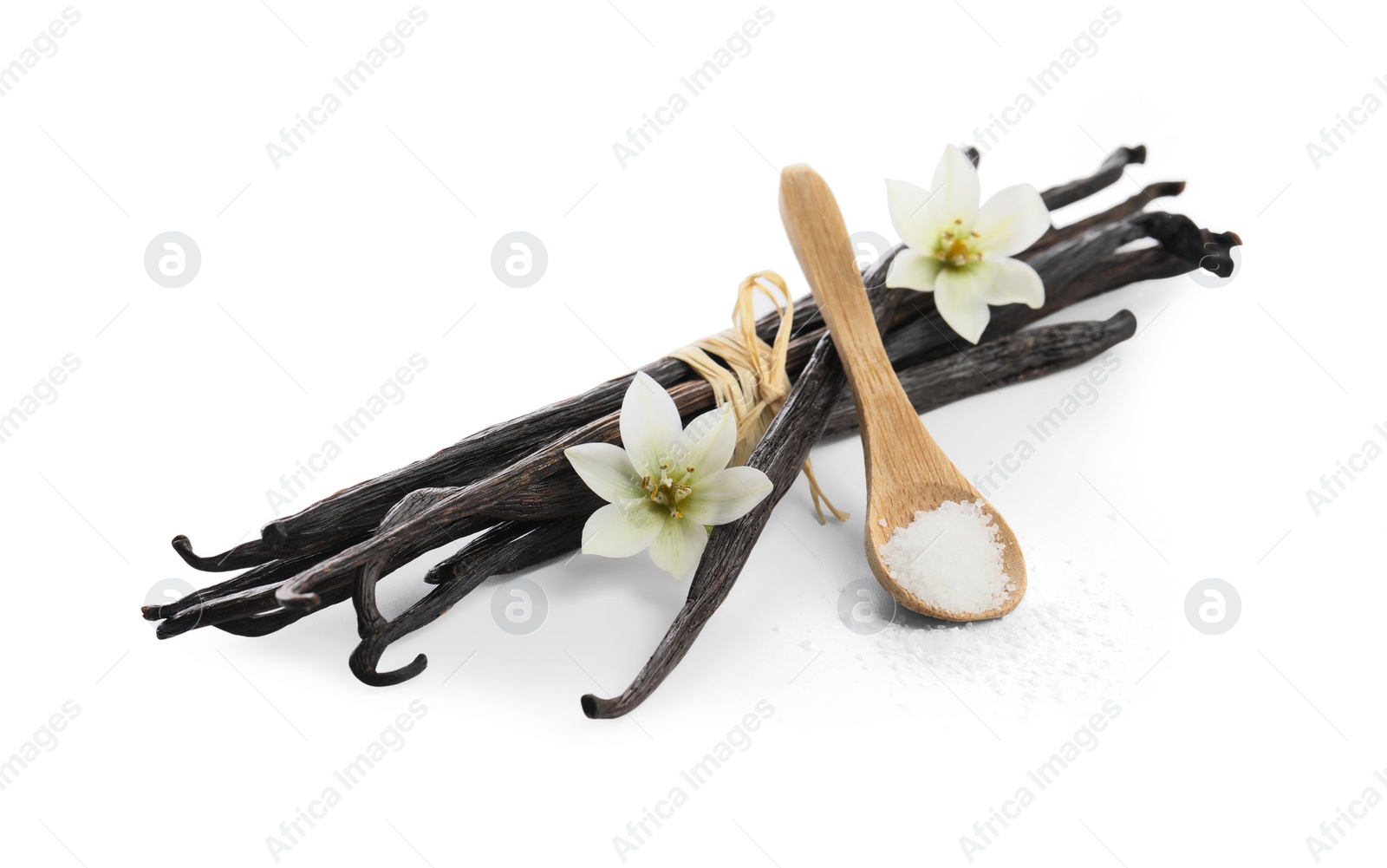 Photo of Vanilla pods, spoon with sugar and flowers isolated on white