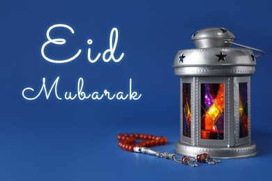 Image of Eid Mubarak greeting card. Arabic lantern and misbaha on blue background