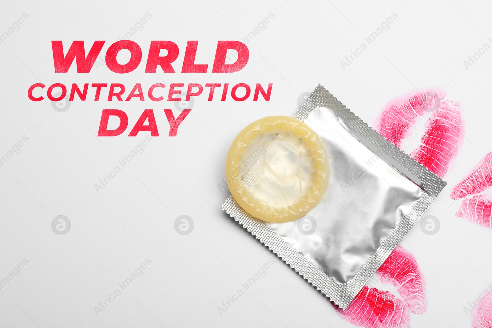 Image of World contraception day. Condom and lipstick kiss marks on white background, top view