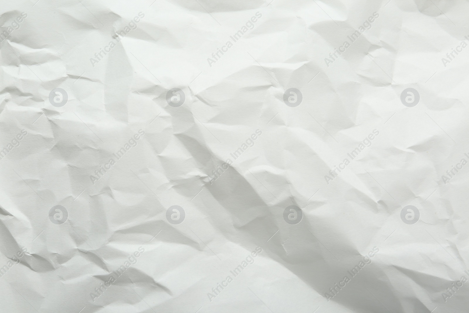 Photo of Crumpled notebook sheet as background, top view