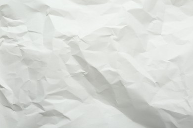 Crumpled notebook sheet as background, top view