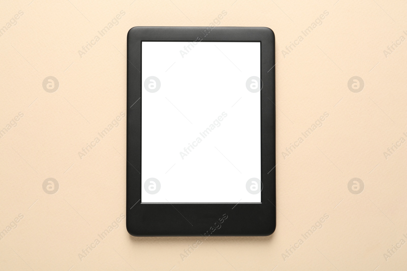 Photo of Modern e-book reader with blank screen on beige background, top view