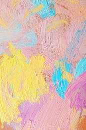 Photo of Closeup view of artist's palette with mixed pastel paints as background