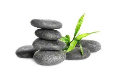 Photo of Spa stones and bamboo sprout on white background