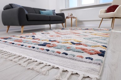 Photo of Living room with beautiful carpet and furniture, low angle view