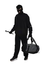 Photo of Thief in balaclava with crowbar and bag on white background