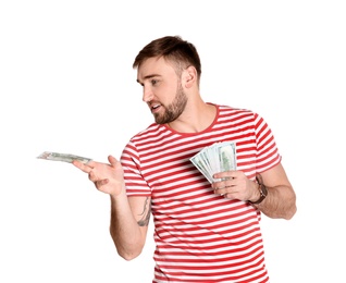 Portrait of young man holding money banknotes on white background