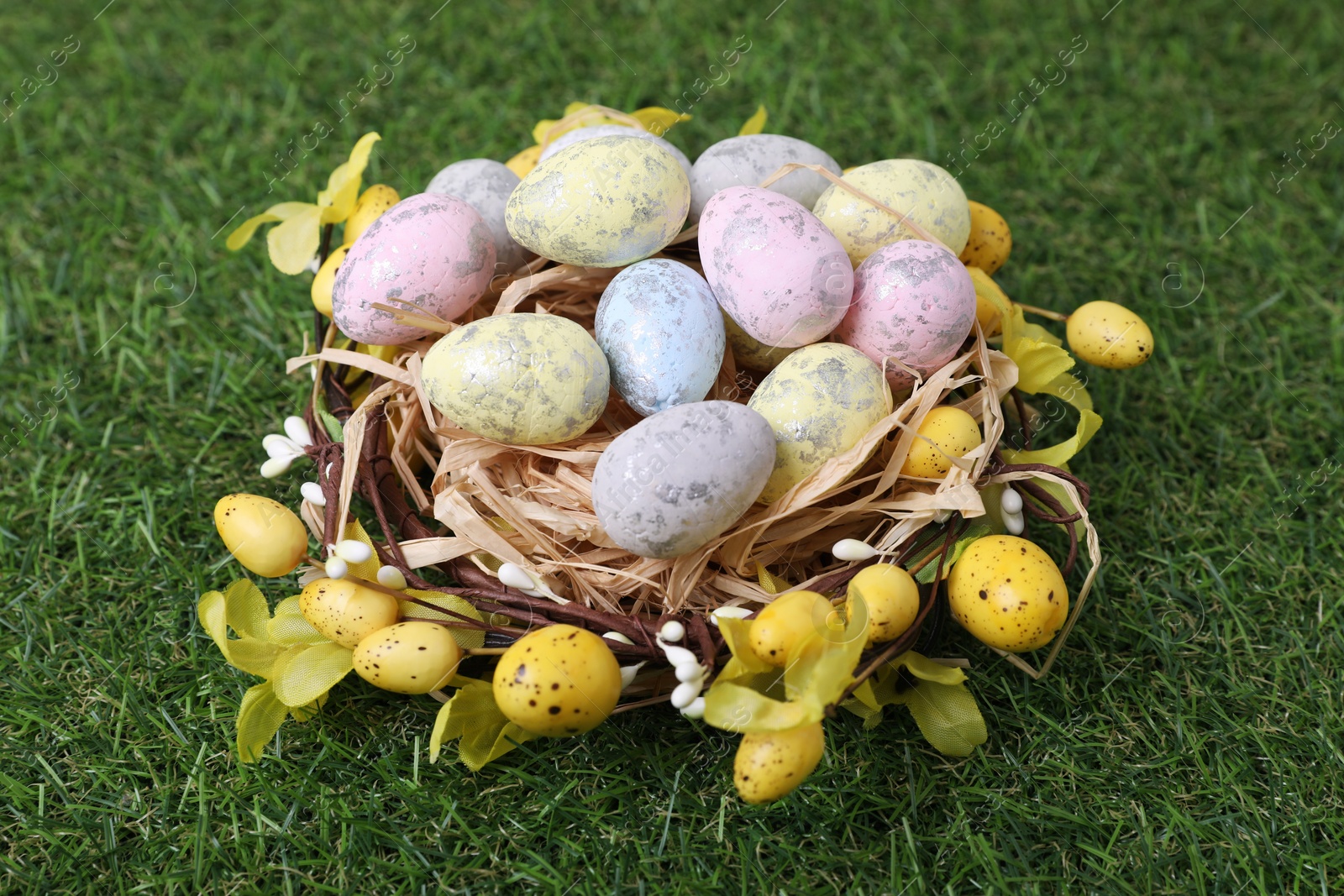 Photo of Festively decorated Easter eggs on green grass