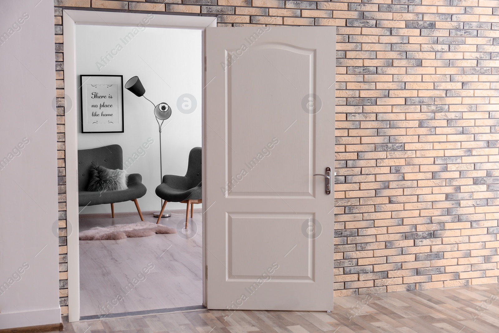 Photo of Stylish room interior, view through open door