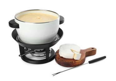 Photo of Fondue with tasty melted cheese, camembert and fork isolated on white