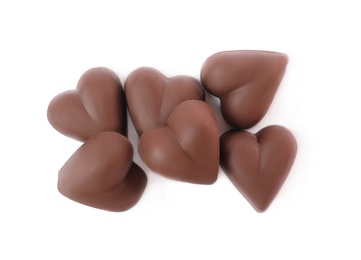Photo of Delicious heart shaped chocolate candies on white background, top view