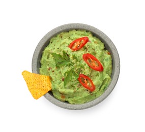 Photo of Bowl of delicious guacamole and nachos chip isolated on white, top view