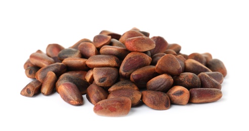 Photo of Heap of pine nuts on white background. Healthy snack