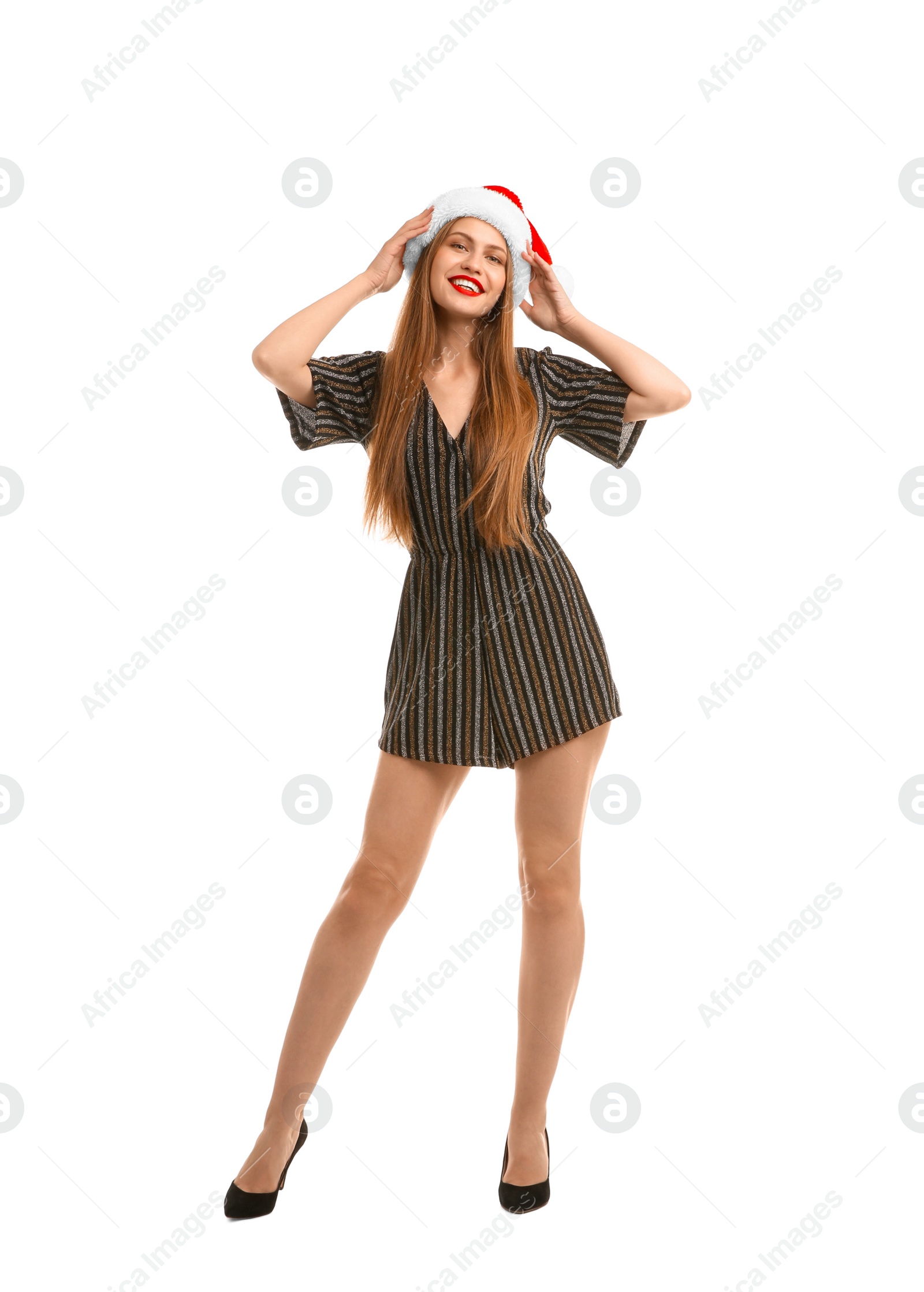 Photo of Young beautiful woman in Santa hat on white background. Christmas celebration