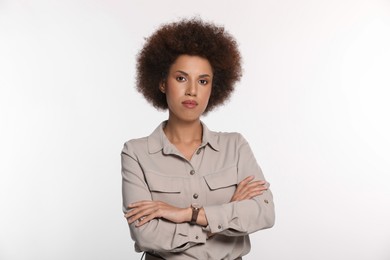 Portrait of beautiful young woman in stylish blouse on white background