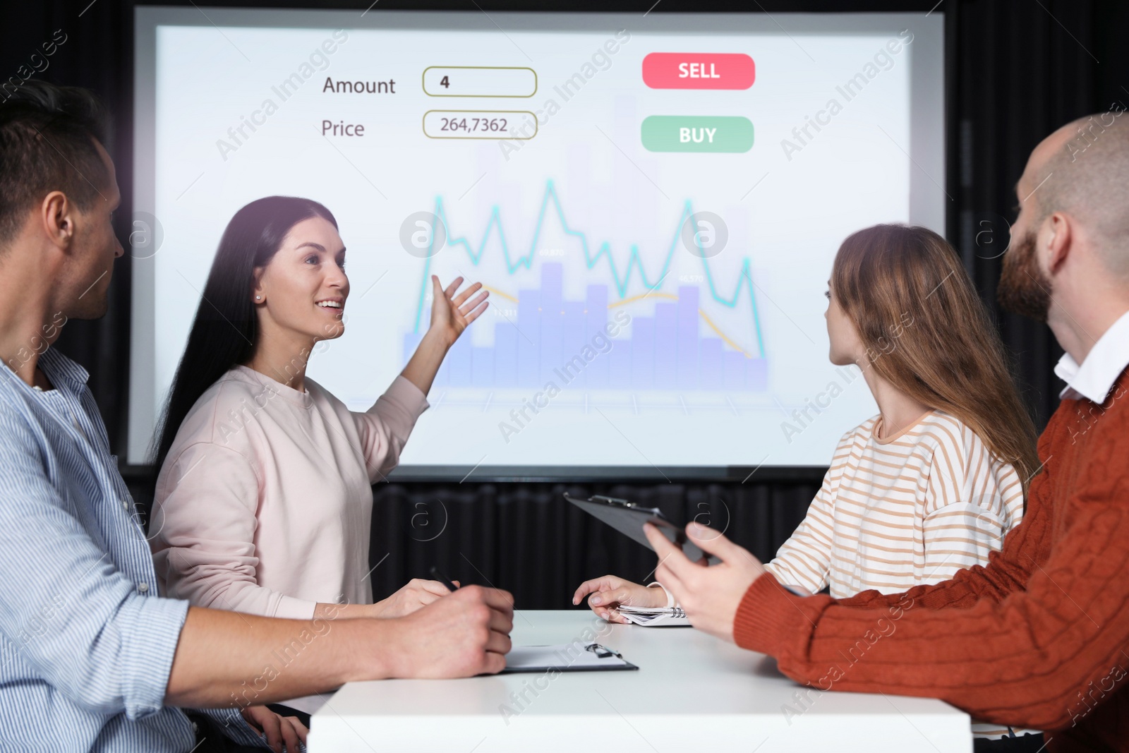 Image of Business people having meeting in office and financial charts on projection screen. Forex conference  