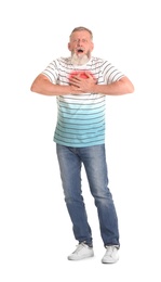 Photo of Mature man having heart attack on white background