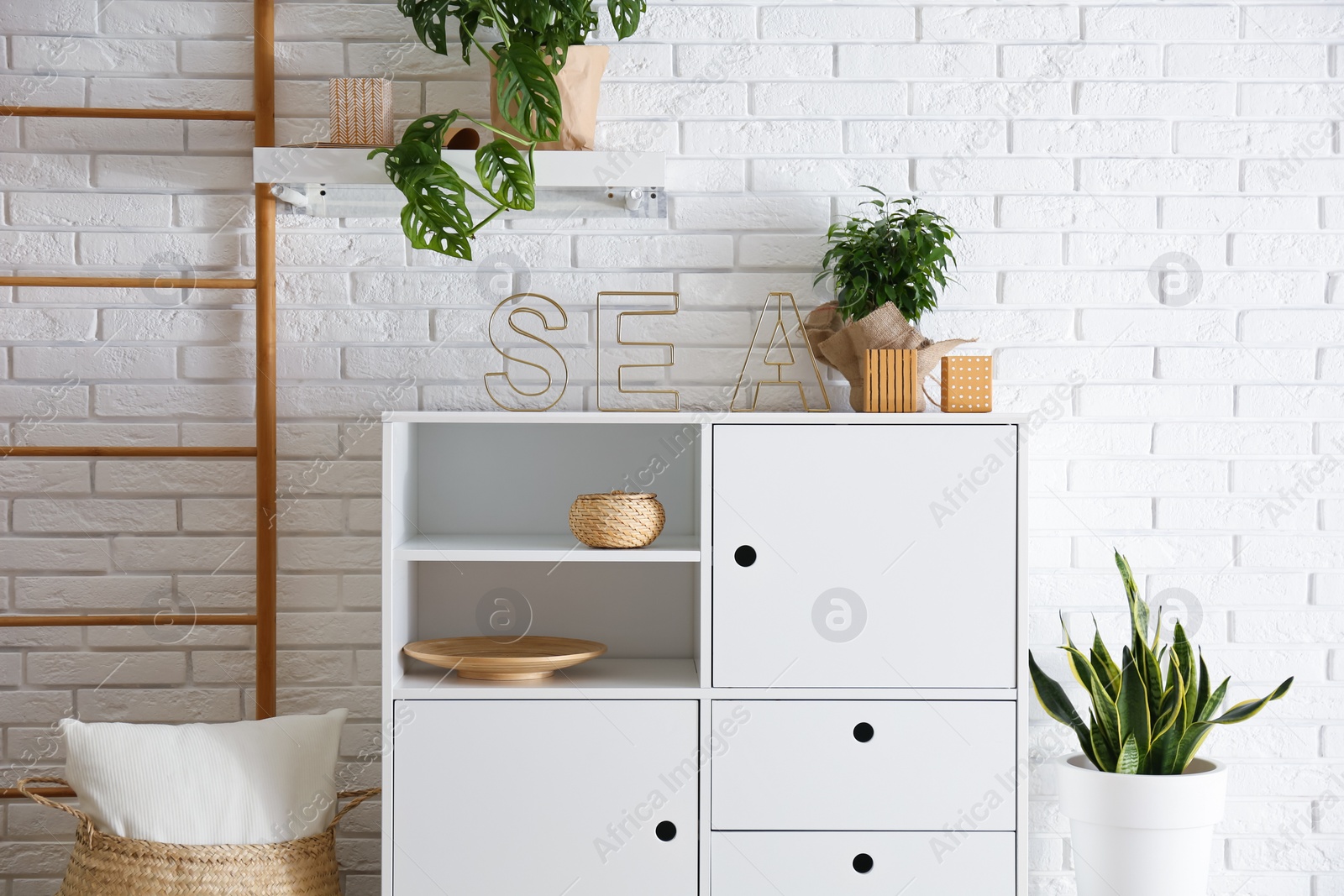 Photo of Chest of drawers in stylish room interior