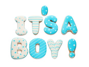 Photo of Phrase IT IS A BOY made of tasty cookies on white background, top view. Baby shower party