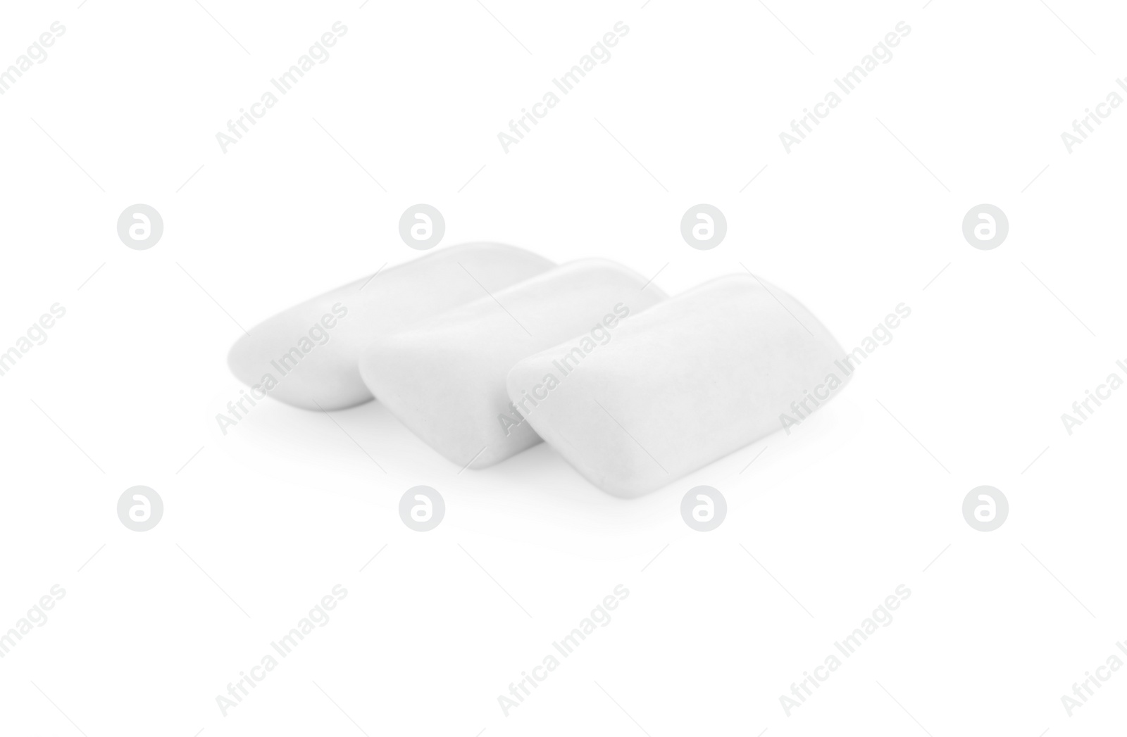 Photo of Three chewing gum pieces on white background