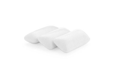 Photo of Three chewing gum pieces on white background