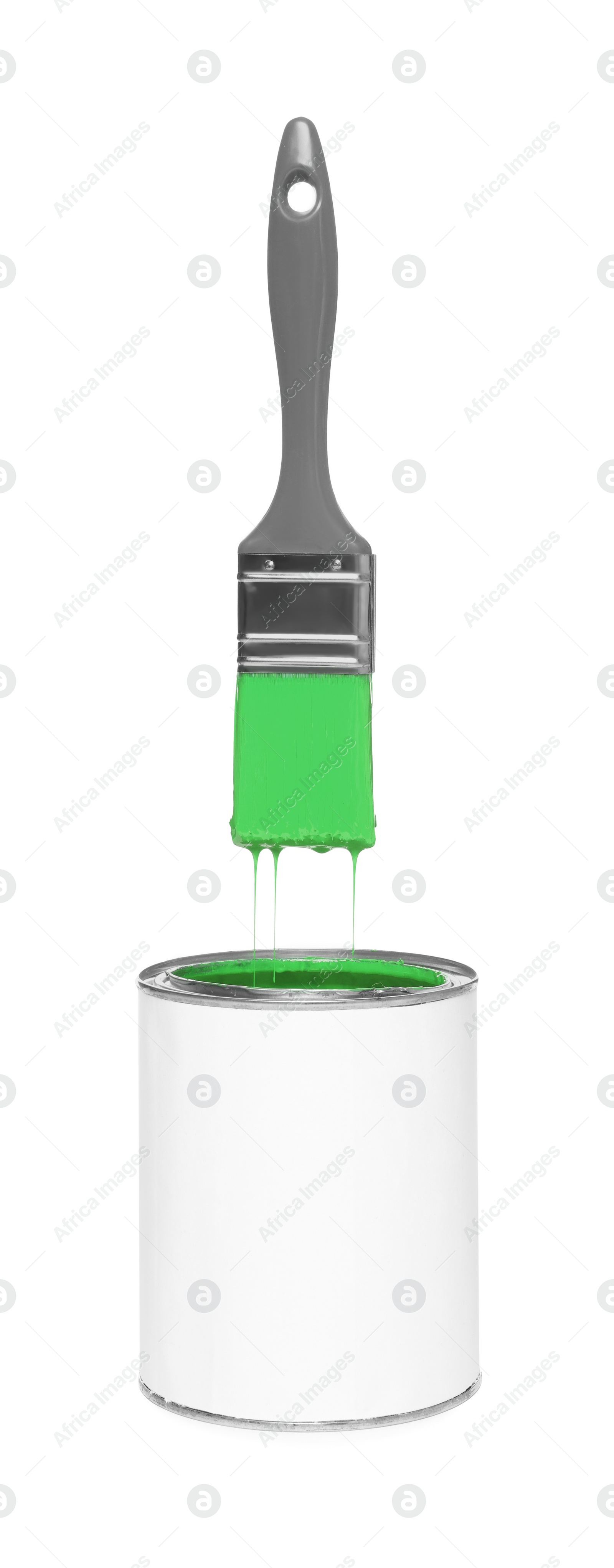 Image of Brush with green paint in air over can on white background