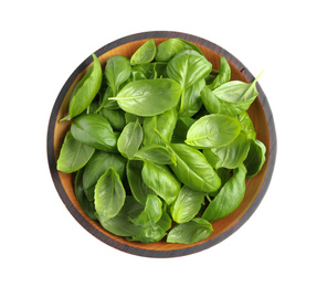 Photo of Fresh basil leaves in wooden bowl isolated on white, top view